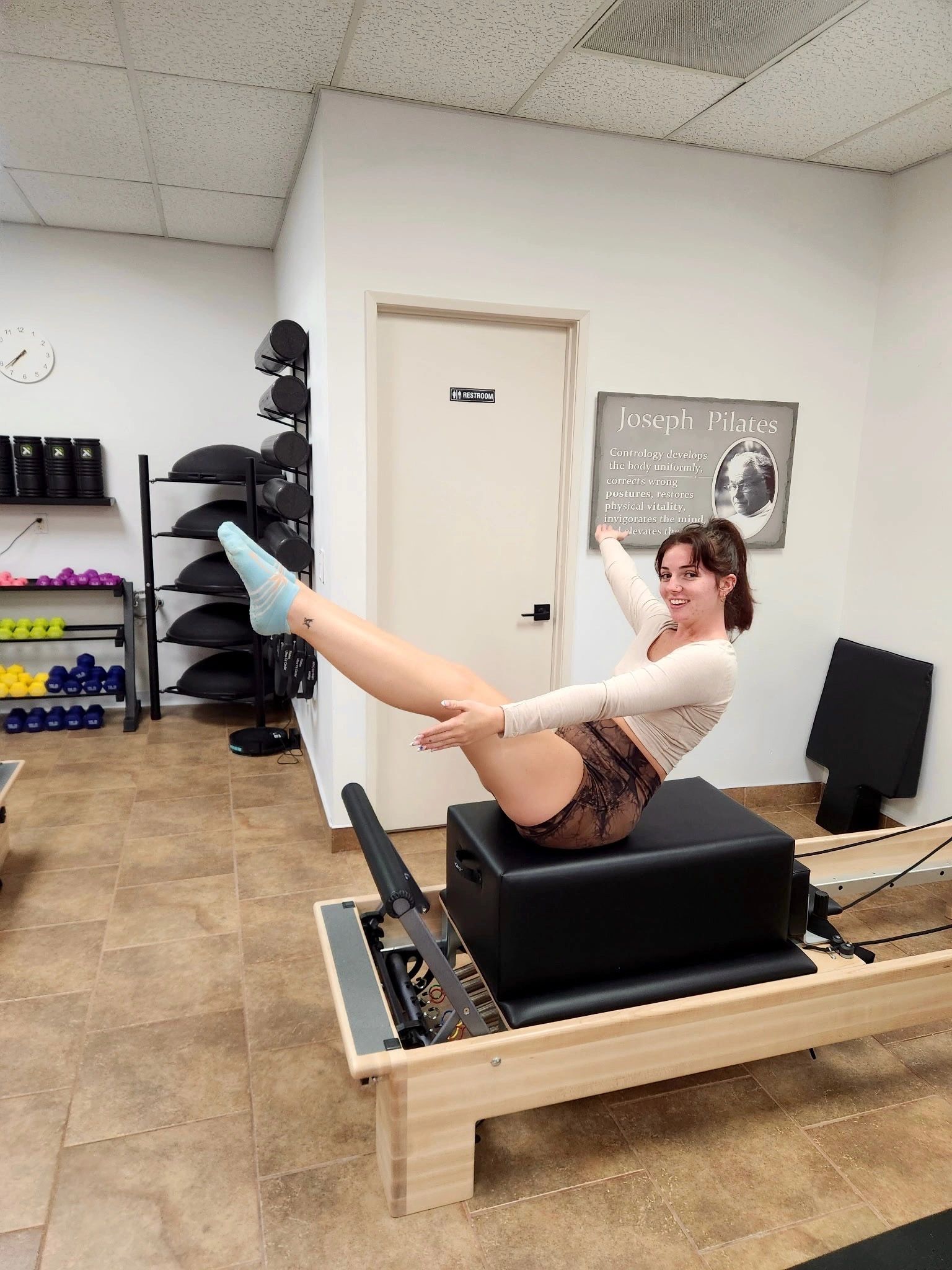 Woman performing Reformer Pilates